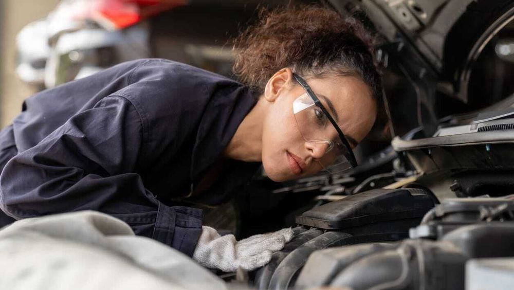Lady fixing car